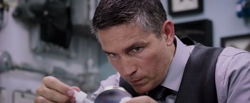 Movie still from “Escape Plan” (2013), directed by Mikael Håfström – A person holding a wii controller; Close Up shot, Over the shoulder angle