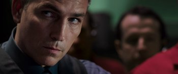 Movie still from “Escape Plan” (2013), directed by Mikael Håfström – A man's eyes and face; Close Up shot, Over the shoulder angle
