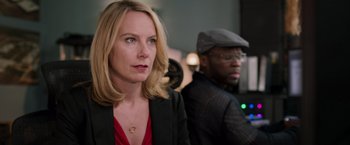 Movie still from “Escape Plan” (2013), directed by Mikael Håfström – A woman in a black jacket and a man in a black jacket; Close Up shot, Over the shoulder angle