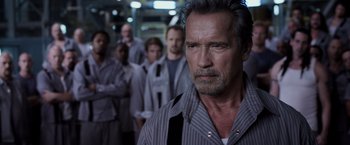 Movie still from “Escape Plan” (2013), directed by Mikael Håfström – A group of men standing next to each other in a room; Close Up shot, Low angle