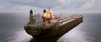 Movie still from “Escape Plan” (2013), directed by Mikael Håfström – An airplane is flying through the air on a ship; Extreme Wide shot, High angle