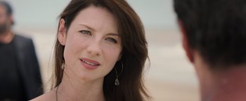 Movie still from “Escape Plan” (2013), directed by Mikael Håfström – A person with long brown hair; Close Up shot, Over the shoulder angle