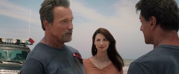 Movie still from “Escape Plan” (2013), directed by Mikael Håfström – A man and a woman standing next to each other on the beach; Close Up shot, Over the shoulder angle