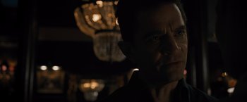 Movie still from “Escape Room: Tournament of Champions” (2021), directed by Adam Robitel – A person in a dark room; Close Up shot, Over the shoulder angle