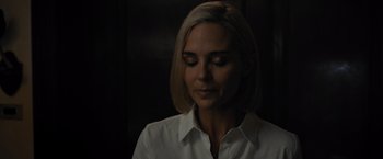Movie still from “Escape Room: Tournament of Champions” (2021), directed by Adam Robitel – A woman in a white shirt is looking down at her face; Close Up shot, High angle