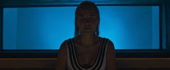 Movie still from “Escape Room: Tournament of Champions” (2021), directed by Adam Robitel – A woman with her eyes closed in front of a window; Close Up shot, Low angle