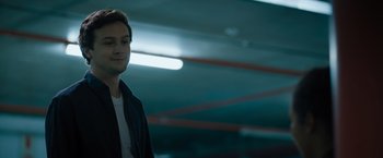 Movie still from “Escape Room: Tournament of Champions” (2021), directed by Adam Robitel – A man standing in a parking lot at night; Close Up shot, Low angle