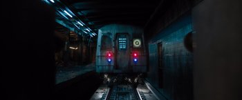 Movie still from “Escape Room: Tournament of Champions” (2021), directed by Adam Robitel – A subway train is stopped at a train station at night; Extreme Wide shot, Low angle