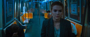 Movie still from “Escape Room: Tournament of Champions” (2021), directed by Adam Robitel – A young woman standing on a subway train platform; Medium shot, Over the shoulder angle