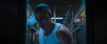 Movie still from “Escape Room: Tournament of Champions” (2021), directed by Adam Robitel – A person wearing a white tank top; Close Up shot, Low angle