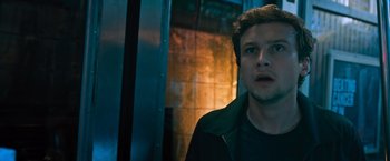 Movie still from “Escape Room: Tournament of Champions” (2021), directed by Adam Robitel – A man standing next to an elevator in a building; Close Up shot, Low angle