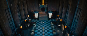 Movie still from “Escape Room: Tournament of Champions” (2021), directed by Adam Robitel – A room filled with tables , chairs , and lights; Extreme Wide shot, High angle