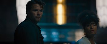 Movie still from “Escape Room: Tournament of Champions” (2021), directed by Adam Robitel – A person wearing a black shirt; Close Up shot, Over the shoulder angle