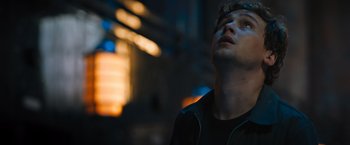 Movie still from “Escape Room: Tournament of Champions” (2021), directed by Adam Robitel – A young man looking up into the air; Close Up shot, Low angle
