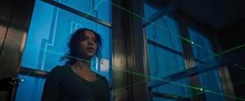 Movie still from “Escape Room: Tournament of Champions” (2021), directed by Adam Robitel – A young girl standing in front of a window; Medium shot, Low angle