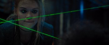 Movie still from “Escape Room: Tournament of Champions” (2021), directed by Adam Robitel – A woman with long blonde hair wearing a black jacket; Extreme Close Up shot, Over the shoulder angle