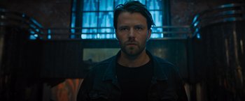 Movie still from “Escape Room: Tournament of Champions” (2021), directed by Adam Robitel – A person wearing a black shirt; Close Up shot, Low angle