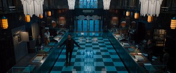 Movie still from “Escape Room: Tournament of Champions” (2021), directed by Adam Robitel – A man standing in the middle of a checkerboard floor; Extreme Wide shot, High angle