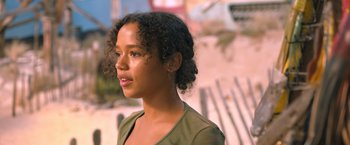 Movie still from “Escape Room: Tournament of Champions” (2021), directed by Adam Robitel – A young woman is looking into the distance; Close Up shot, Low angle