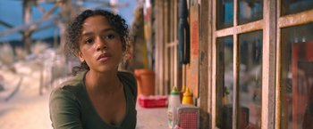 Movie still from “Escape Room: Tournament of Champions” (2021), directed by Adam Robitel – A young girl sitting on the side of the street; Close Up shot, Low angle