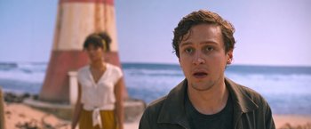 Movie still from “Escape Room: Tournament of Champions” (2021), directed by Adam Robitel – A man and a woman standing next to each other on the beach; Close Up shot, Over the shoulder angle