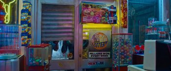 Movie still from “Escape Room: Tournament of Champions” (2021), directed by Adam Robitel – A vending machine that has a lot of toys in it; Wide shot, High angle