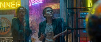 Movie still from “Escape Room: Tournament of Champions” (2021), directed by Adam Robitel – A woman standing in front of a store window; Medium shot, Low angle