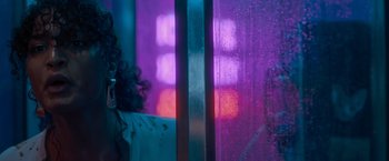 Movie still from “Escape Room: Tournament of Champions” (2021), directed by Adam Robitel – A woman standing in front of a window in the rain; Close Up shot, Low angle