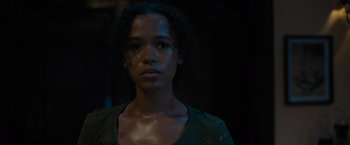Movie still from “Escape Room: Tournament of Champions” (2021), directed by Adam Robitel – A young woman is looking into the camera; Close Up shot, Low angle