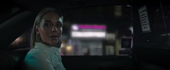 Movie still from “Escape Room: Tournament of Champions” (2021), directed by Adam Robitel – A woman sitting in the back seat of a car at night; Close Up shot, Over the shoulder angle