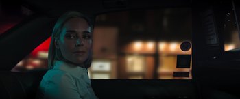 Movie still from “Escape Room: Tournament of Champions” (2021), directed by Adam Robitel – A woman sitting in the back seat of a car at night; Close Up shot, Over the shoulder angle