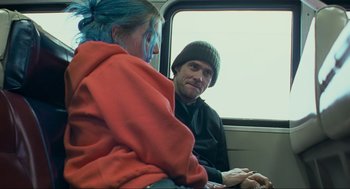 Movie still from “Eternal Sunshine of the Spotless Mind” (2004), directed by Michel Gondry – A man and a woman sitting on a bus; Medium shot, Over the shoulder angle