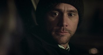 Movie still from “Eternal Sunshine of the Spotless Mind” (2004), directed by Michel Gondry – A person wearing a hat; Close Up shot, Over the shoulder angle