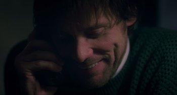 Movie still from “Eternal Sunshine of the Spotless Mind” (2004), directed by Michel Gondry – A person talking on a cell phone; Close Up shot, High angle