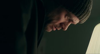 Movie still from “Eternal Sunshine of the Spotless Mind” (2004), directed by Michel Gondry – A man's face in the dark; Close Up shot, Low angle