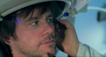 Movie still from “Eternal Sunshine of the Spotless Mind” (2004), directed by Michel Gondry – A person with a helmet on; Close Up shot, Over the shoulder angle