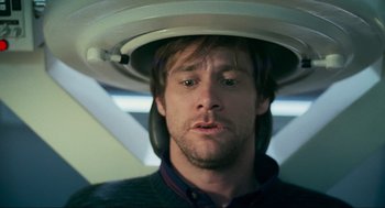 Movie still from “Eternal Sunshine of the Spotless Mind” (2004), directed by Michel Gondry – A person wearing a helmet on his head; Close Up shot, Over the shoulder angle