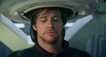 Movie still from “Eternal Sunshine of the Spotless Mind” (2004), directed by Michel Gondry – A person with a hat on his head; Close Up shot, High angle