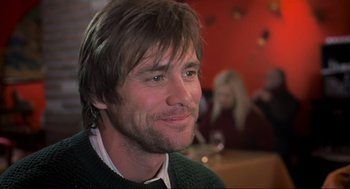 Movie still from “Eternal Sunshine of the Spotless Mind” (2004), directed by Michel Gondry – A person wearing a green sweater; Close Up shot, Over the shoulder angle