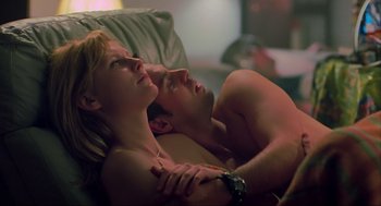 Movie still from “Eternal Sunshine of the Spotless Mind” (2004), directed by Michel Gondry – A man and a woman laying on a couch together; Close Up shot, Low angle