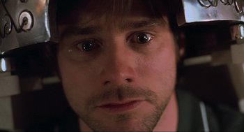 Movie still from “Eternal Sunshine of the Spotless Mind” (2004), directed by Michel Gondry – A man's eyes and face; Extreme Close Up shot, Low angle