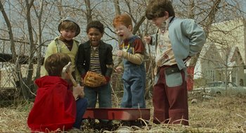 Movie still from “Eternal Sunshine of the Spotless Mind” (2004), directed by Michel Gondry – A group of children standing around a tree; Medium shot, High angle