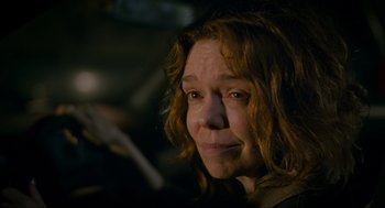 Movie still from “Eternal Sunshine of the Spotless Mind” (2004), directed by Michel Gondry – A person with long red hair; Close Up shot, Over the shoulder angle