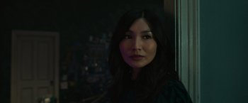 Movie still from “Eternals” (2021), directed by Chloé Zhao – A person with long black hair; Close Up shot, Over the shoulder angle