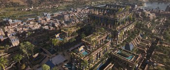Movie still from “Eternals” (2021), directed by Chloé Zhao – An aerial view of an ancient city with pools and buildings; Extreme Wide shot, Overhead angle