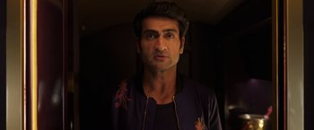 Movie still from “Eternals” (2021), directed by Chloé Zhao – A person wearing a jacket; Close Up shot, Low angle