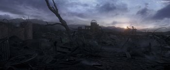 Movie still from “Eternals” (2021), directed by Chloé Zhao – A tree in the middle of a field with a building in the background; Extreme Wide shot, High angle