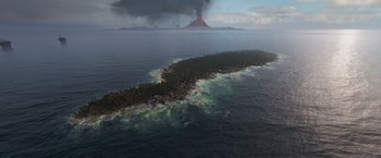 Movie still from “Eternals” (2021), directed by Chloé Zhao – An island in the middle of the ocean with a volcano in the background; Extreme Wide shot, High angle
