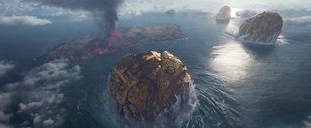 Movie still from “Eternals” (2021), directed by Chloé Zhao – An aerial view of an island with graffiti on it; Extreme Wide shot, High angle