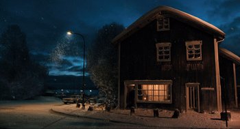 Movie still from “Eurovision Song Contest: The Story of Fire Saga” (2020), directed by David Dobkin – A house that has a window lit up at night; Extreme Wide shot, Low angle